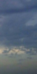 MATTHEW SWARTS A BLURRED IMAGE OF A CLOUDY SKY, WITH VARIOUS SHADES OF BLUE AND GRAY CLOUDS SCATTERED ACROSS THE SCENE.