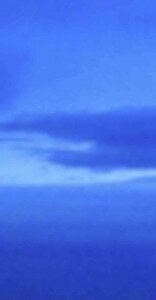 MATTHEW SWARTS A BLURRED IMAGE SHOWING VARIOUS SHADES OF BLUE, RESEMBLING AN ABSTRACT SKY WITH SOFT, LAYERED CLOUDS.