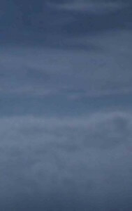 MATTHEW SWARTS A CLOUDY SKY WITH VARYING SHADES OF GRAY, FEATURING SOFT, LAYERED CLOUDS CREATING A CALM AND OVERCAST ATMOSPHERE.