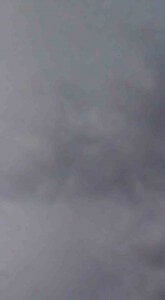 MATTHEW SWARTS A DENSE CLOUD OF GRAY SMOKE OR FOG FILLS THE IMAGE, OBSCURING ANY CLEAR DETAILS IN THE BACKGROUND. THE ATMOSPHERE APPEARS MISTY AND UNCLEAR.