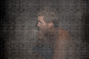 MATTHEW SWARTS A MAN WITH SHORT HAIR SITS IN PROFILE, APPEARING DEEP IN THOUGHT WITH HIS HAND TOUCHING HIS MOUTH. CONTEMPORARY, WEB-LIKE TEXTURES OVERLAY THE SCENE, LENDING AN ART DOCUMENTARY FEEL THAT PARTIALLY OBSCURES THE INTROSPECTIVE MOMENT.