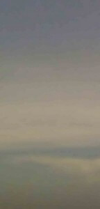 MATTHEW SWARTS SOFTLY PAINTED SKY WITH SUBTLE GRADIENTS OF MUTED BLUES, GRAYS, AND CREAMS.