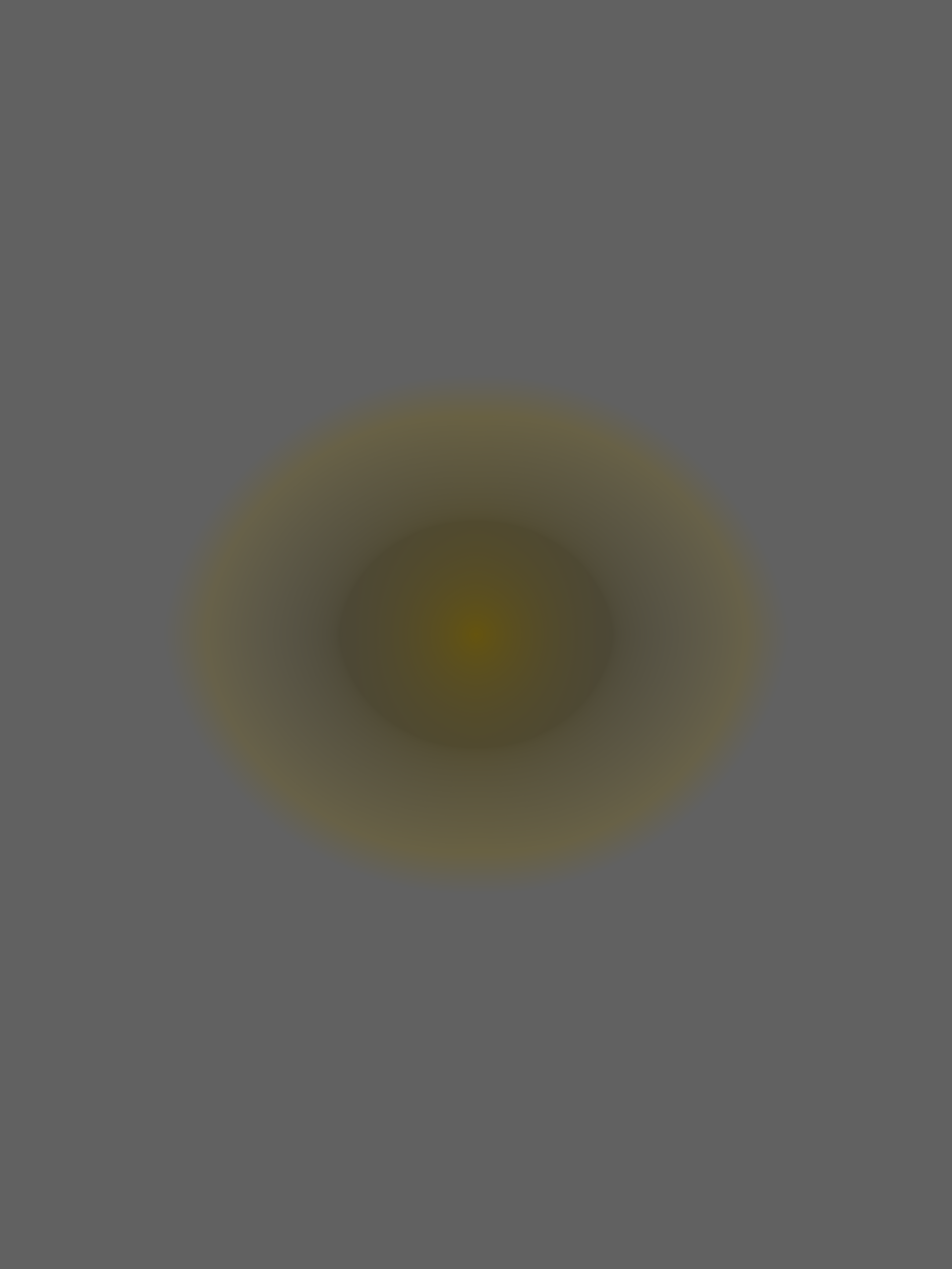 MATTHEW SWARTS A dark, blurry oval shape with a hazy yellowish-brown center evokes abstract art against a plain gray background. The edges of the oval gradually fade into the surrounding gray.