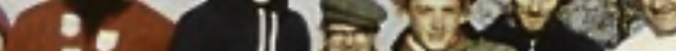 MATTHEW SWARTS A cropped and blurry image in the style of fine art photography shows a group of people standing close together, some wearing glasses and diverse clothing, set against a light background.