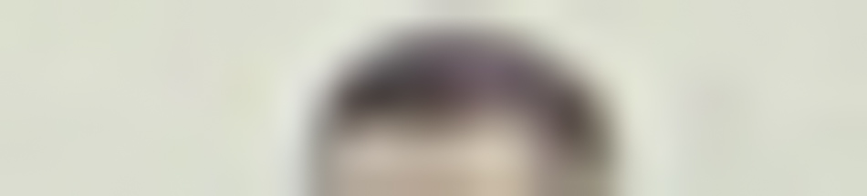 MATTHEW SWARTS A very blurry image showing the top portion of a person's head with short, dark hair against a plain light background, capturing the abstract essence of fine art photography. No facial features or details are visible.