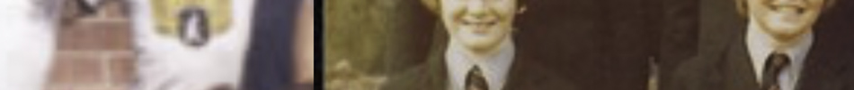 MATTHEW SWARTS A blurry, cropped image by artist Matthew Swarts shows part of a person in a suit and tie, with another figure partially visible. The background appears to be indoors, with muted colors.