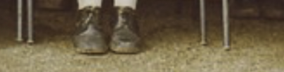MATTHEW SWARTS A close-up by an artist shows a pair of feet in brown shoes and white socks, positioned on a beige carpet with metal chair legs visible in the background.