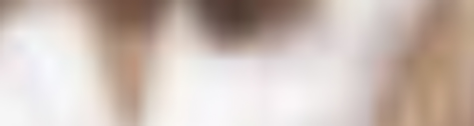MATTHEW SWARTS The image is very blurry and unfocused, making it difficult to distinguish any clear shapes, objects, or people. The dominant colors are light tones—white, pink, and beige—evoking an abstract style often seen in modern photography.