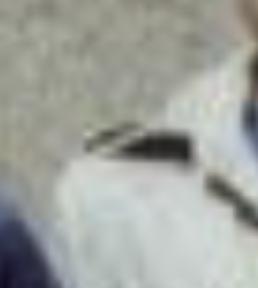 MATTHEW SWARTS A close-up, blurry image showing part of a light-colored garment with a dark shoulder strap and an indistinct background evokes a sense of contemporary art.