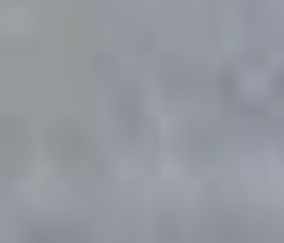 MATTHEW SWARTS A blurry, grayish-blue background with no clear shapes or distinct objects visible, echoing the abstract photography style of Matthew Swarts. The image appears out of focus and lacks identifiable details.
