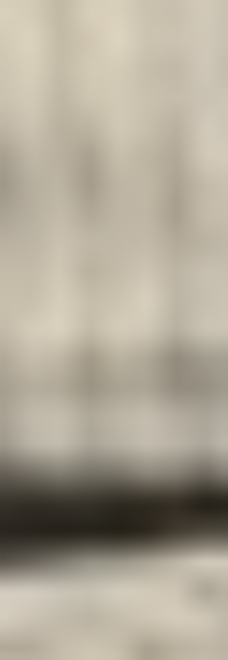 MATTHEW SWARTS A blurred image with beige and brown tones, featuring soft horizontal and vertical lines, evokes the abstract style of contemporary photography. No distinct objects or features are recognizable.
