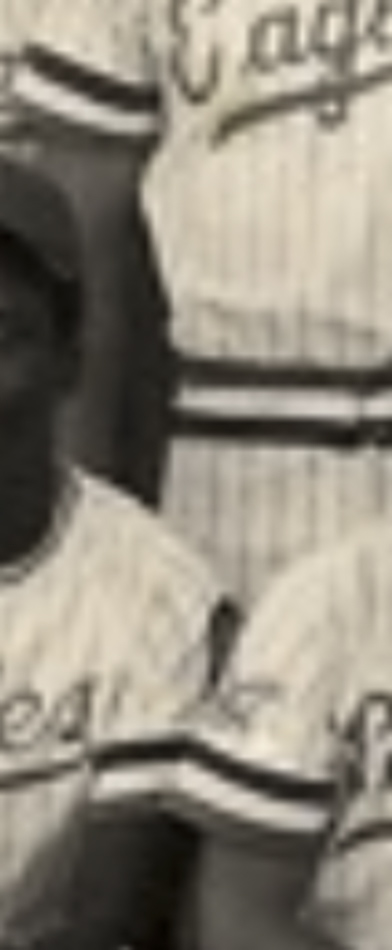 MATTHEW SWARTS A cropped, sepia-toned photo shows two people in striped baseball uniforms with script lettering across the chest—a striking example of CONTEMPORARY ART, focusing on form and detail. Only their torsos and parts of their arms are visible.