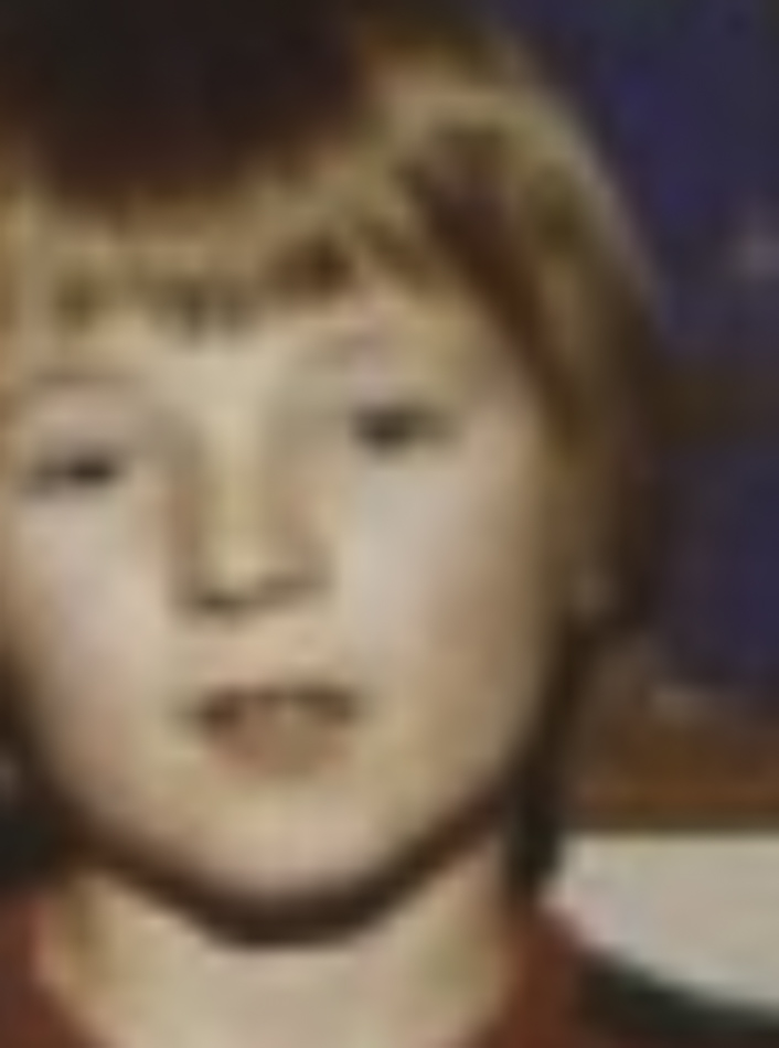 MATTHEW SWARTS A blurry close-up of a young child with light brown hair and fair skin, facing the camera. The indistinct background enhances the image’s fine art photography appeal, giving it a contemporary art feel.