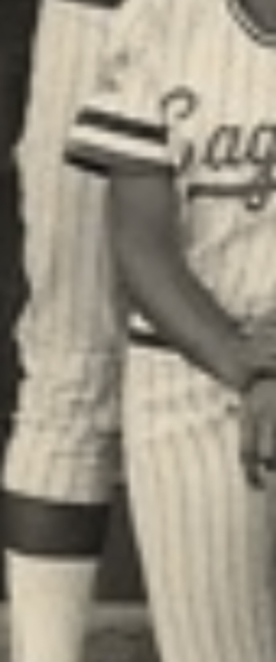 MATTHEW SWARTS A sepia-toned close-up of a person wearing a vintage pinstriped baseball uniform with “ague” partially visible on the jersey spotlights the torso and arms, evoking visual art reminiscent of MATTHEW SWARTS’s distinctive style.