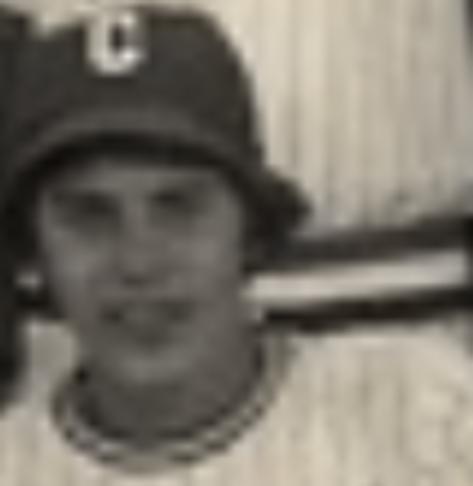 MATTHEW SWARTS A sepia-toned, blurry close-up of a young person wearing a baseball cap with a large letter C and a striped shirt, looking toward the camera—a portrait reminiscent of contemporary art by Matthew Swarts.