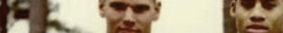 MATTHEW SWARTS A very blurry close-up image of two people’s faces, making their features indistinguishable, evokes the enigmatic style of VISUAL ART by Matthew Swarts. The background is also out of focus.