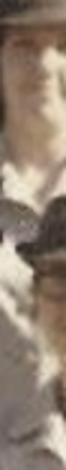 MATTHEW SWARTS A blurred, vertical close-up image in the style of FINE ART PHOTOGRAPHY by MATTHEW SWARTS, showing two light-skinned faces with indistinct features and pale clothing. Cropped composition adds to the mysterious nature of this VISUAL ART piece.