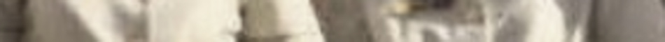 MATTHEW SWARTS Two light-colored, possibly beige or white, garments hanging side by side, captured in soft lighting with a blurred background—a serene moment of fine art photography that elevates everyday details into contemporary art.
