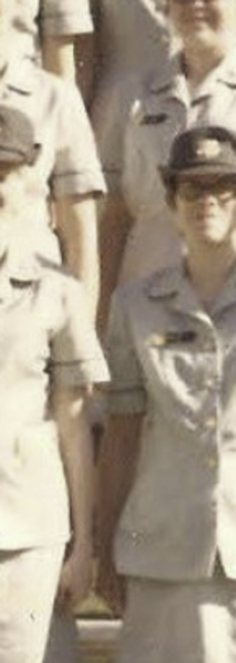 MATTHEW SWARTS A group of people standing in formation, wearing light-colored military or uniformed attire with caps; only the upper bodies of several individuals are visible in this visual art piece by artist Matthew Swarts.