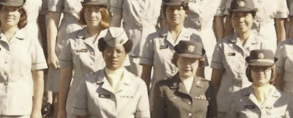 MATTHEW SWARTS A vintage group photo of women in military uniforms standing in rows, smiling and posing for the camera in outdoor daylight—a striking moment that could inspire any contemporary art artist.