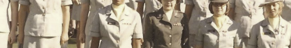MATTHEW SWARTS A group of uniformed women standing in rows, some in light-colored uniforms and others in dark; only their upper bodies are visible—a striking example of fine art photography by artist Matthew Swarts.