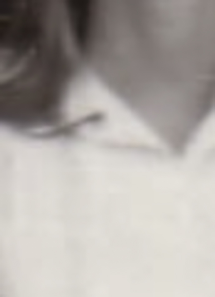 MATTHEW SWARTS A close-up, slightly blurry image in the style of fine art photography shows part of a person's neck, chin, and the collar of a light-colored shirt. The image appears to be cropped tightly, with some hair visible on the left—evoking Matthew Swarts' work.