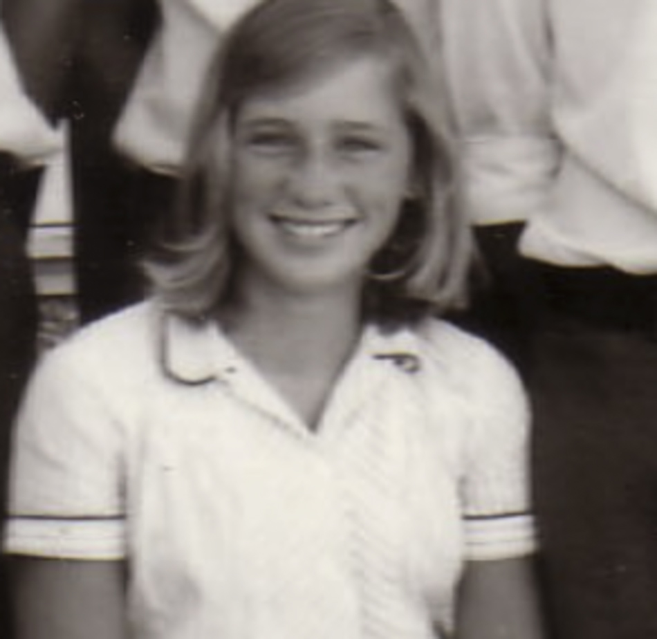 MATTHEW SWARTS A young girl with shoulder-length light hair is smiling at the camera in this fine art photography piece. She wears a light-colored collared shirt with dark trim, while Matthew Swarts softly blurs the background to highlight her presence.