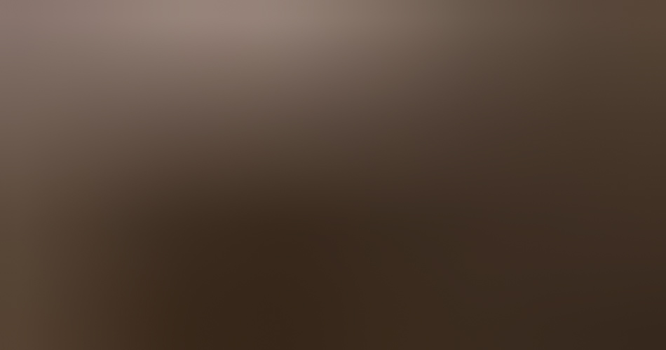 MATTHEW SWARTS A blurry image with a gradient of brown and reddish hues, lacking any distinct shapes or clear objects, evokes the abstract style often found in Matthew Swarts' visual art.