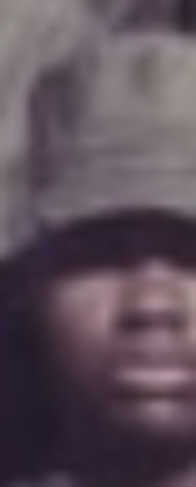 MATTHEW SWARTS A blurred close-up image of a person's face, partially obscured by a wide-brimmed hat casting a shadow over their eyes and forehead, evokes the signature style of fine art photography artist Matthew Swarts. The features are indistinct due to the blurriness.