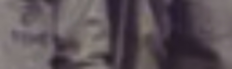 MATTHEW SWARTS A very blurry image of a person standing and holding something, with indistinct background details and unclear facial features—an evocative example of contemporary art within fine art photography.
