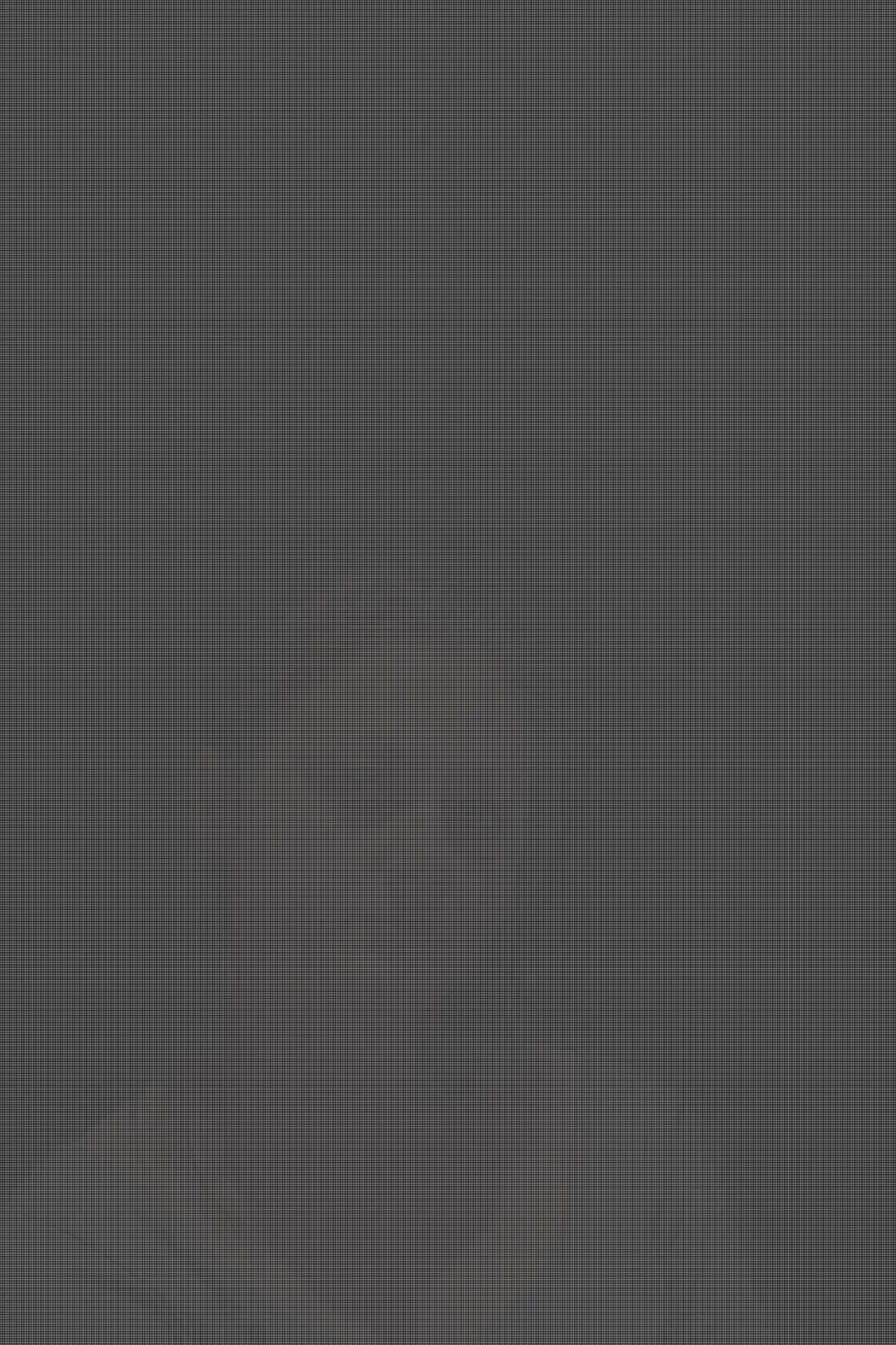 MATTHEW SWARTS A person with long hair, wearing a loose shirt, sits against a dark, plain background, looking slightly down with a neutral expression. The dim lighting and moody atmosphere reflect MATTHEW SWARTS’s visual artistry.